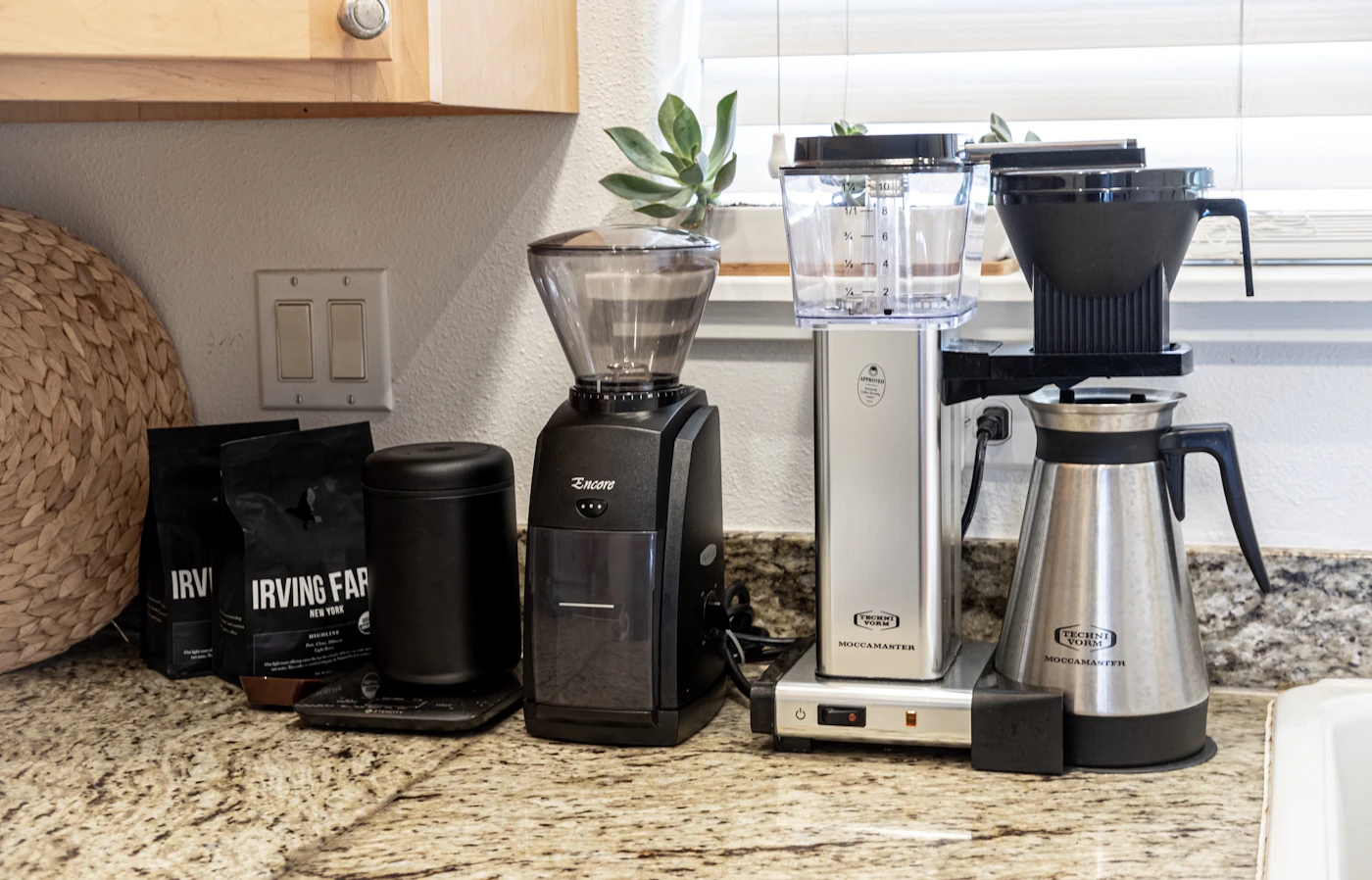 A blender and coffee maker on a home kitchen counter