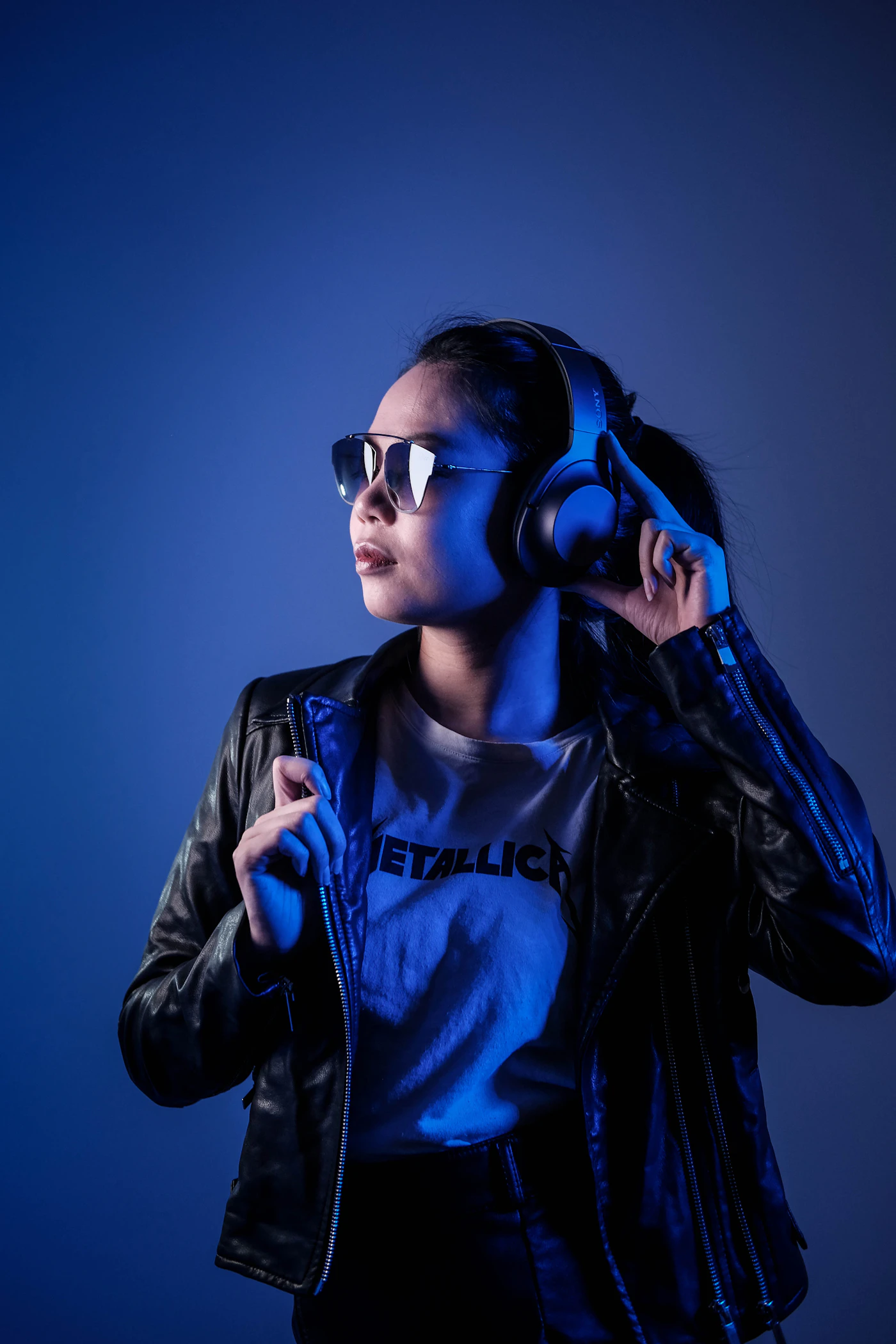 A person wearing headphones and sunglasses